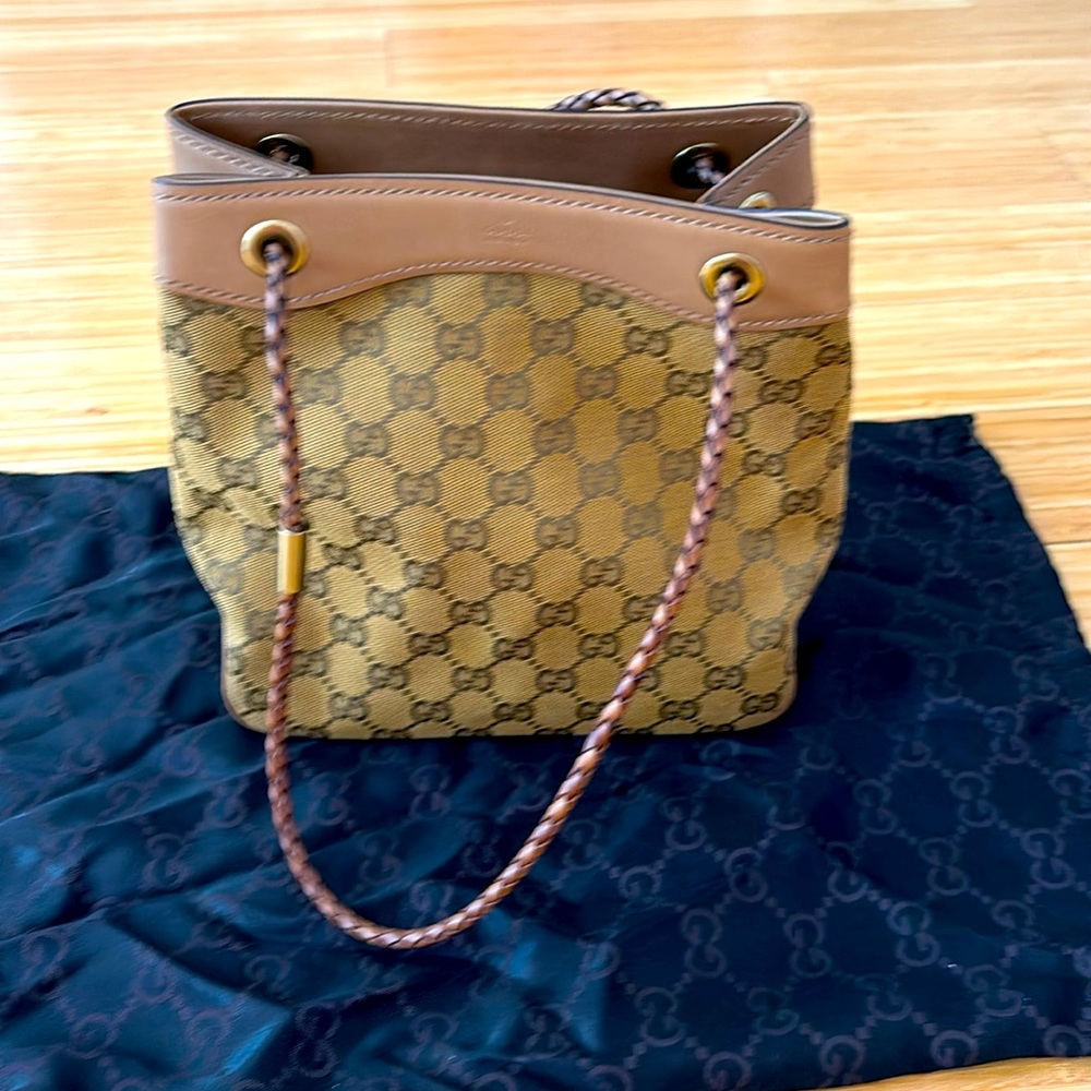 Gucci tote in brown gucci pattern and leather bottom and straps